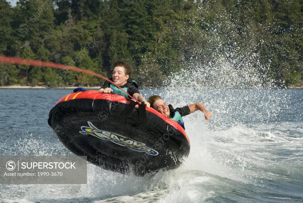 Inner tubers get airborne off sidney island, in gulf islands national park, british columbia, canada