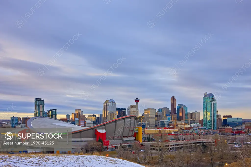 The Saddledome with high_rise buildings and the Calgary Tower in the background, City of Calgary, Alberta, Canada.