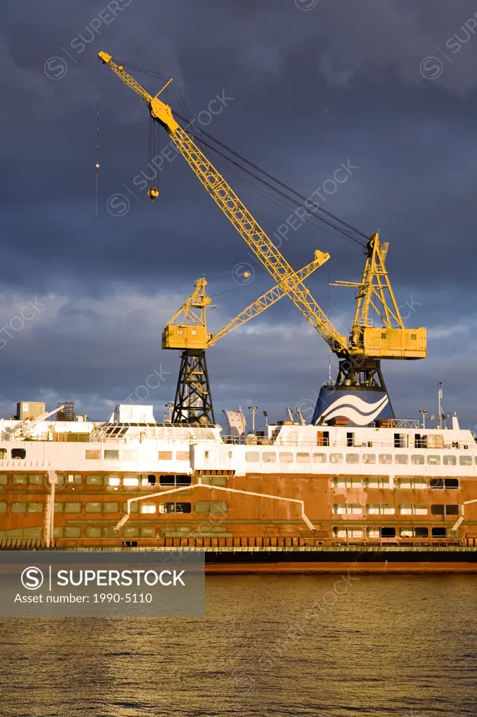 B C  Ferries ship being refurbished in dock, cargo cranes, Vancouver Harbour at Lonsdale Quay, British Columbia, Canada