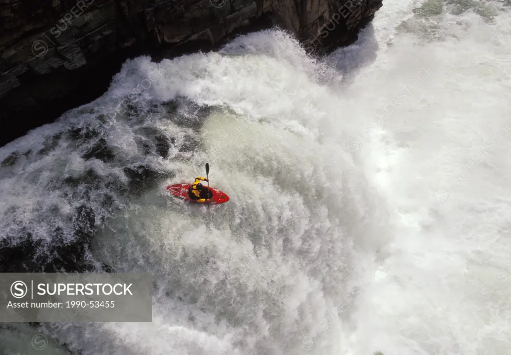 Kayaker running ´Leap Of Faith´ waterfall on Elk River near Fernie in East Kootenays, British Columbia, Canada.