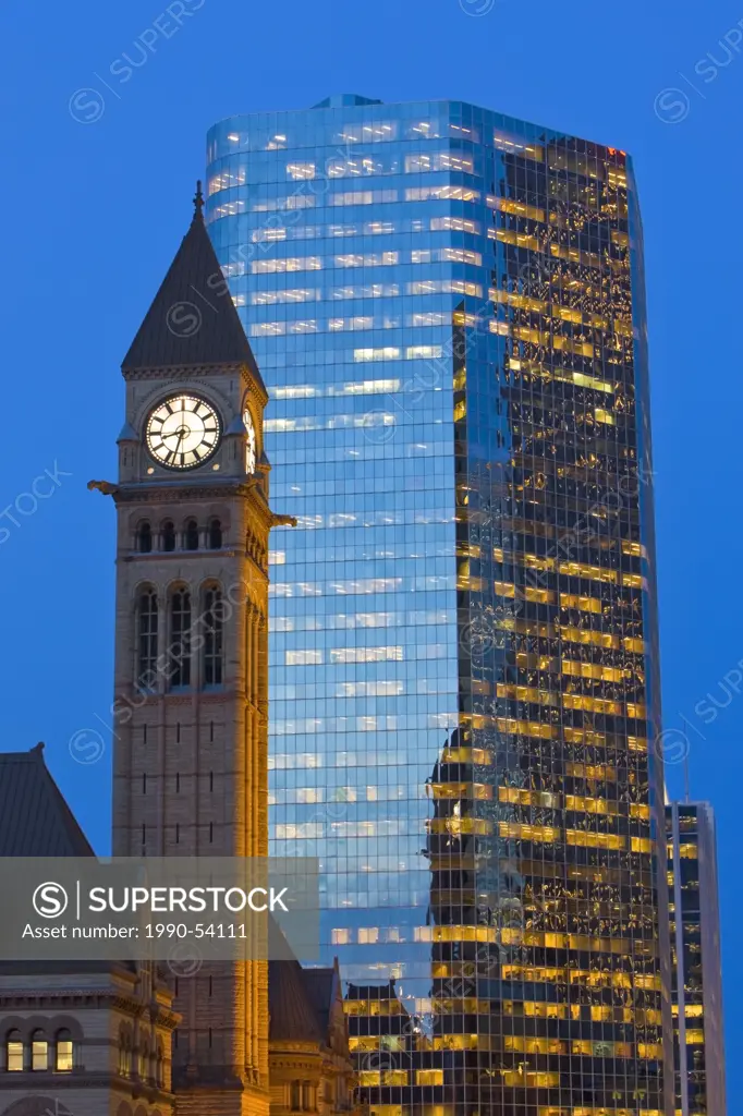 Clock tower of the Old City Hall and a modern office building in downtown Toronto at dusk, Ontario, Canada