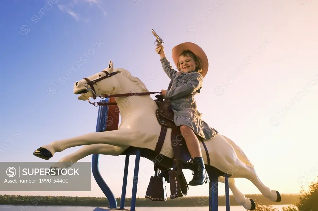 6 year old girl on pony amusement ride, Canada.