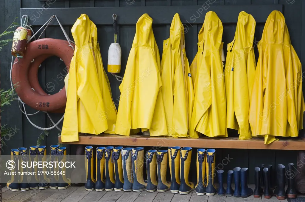 Yellow raincoats and boots outside Middle Beach Lodge, Vancouver Island, British Columbia, Canada.