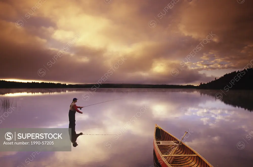 fly fishing on 108 Mile Lake, British Columbia, Canada.