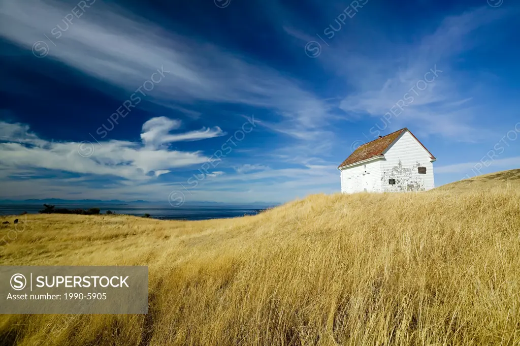 Old fog horn building at East Point park & lighthouse, Saturna Island, British Columbia, Canada