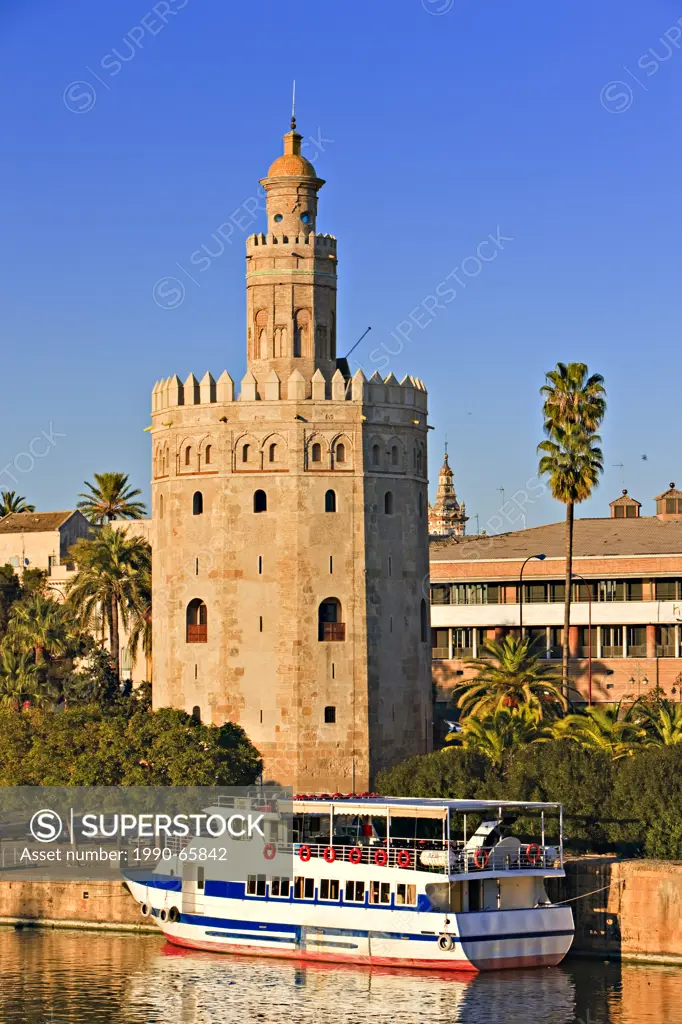 Torre del Oro Tower of Gold which also houses the Museo Maritimo Naval Museum on the banks of Rio Guadalquivir River, El Arenal District, City of Sevi...