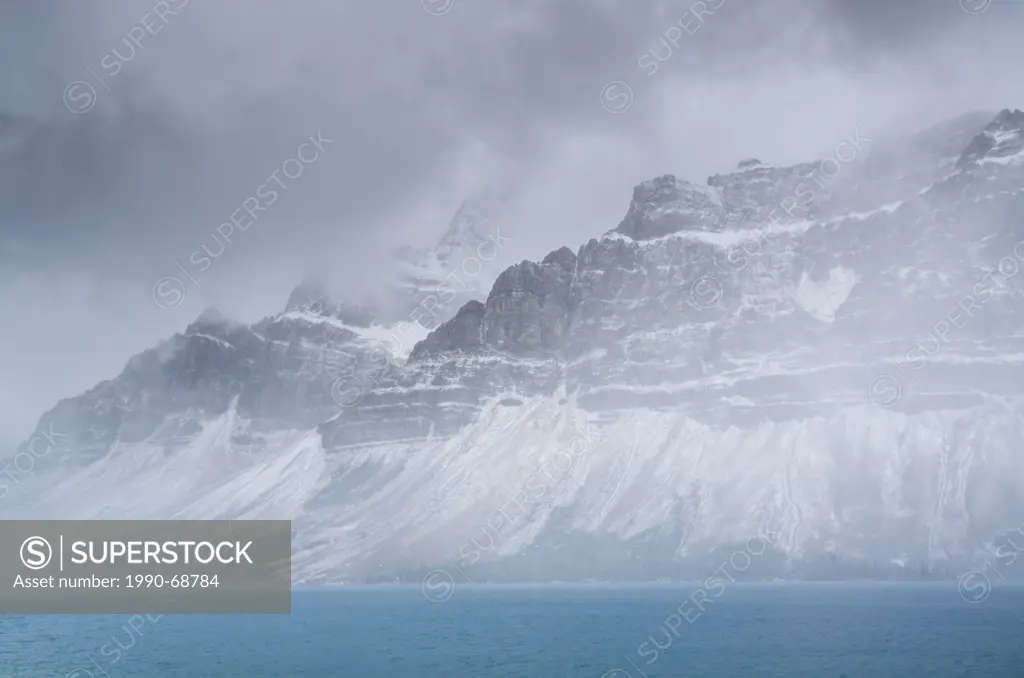 Snow storm over Bow Lake and Crowfoot mountain in Banff National Park, Alberta, Canada.