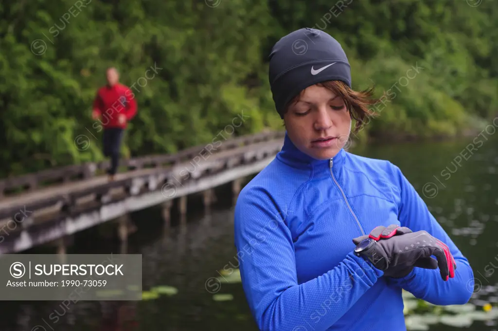 Running and hiking on the trail around Sasamat Lake, Belcarra Regional Park, Port Moody, British Columbia, Canada