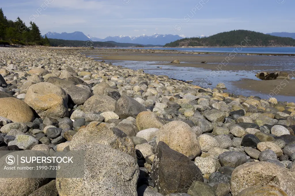 Seashore at Hollyhock educational retreat center, Coast Range Mountains in distance, Cortes Island, Britsh Columbia, Canada