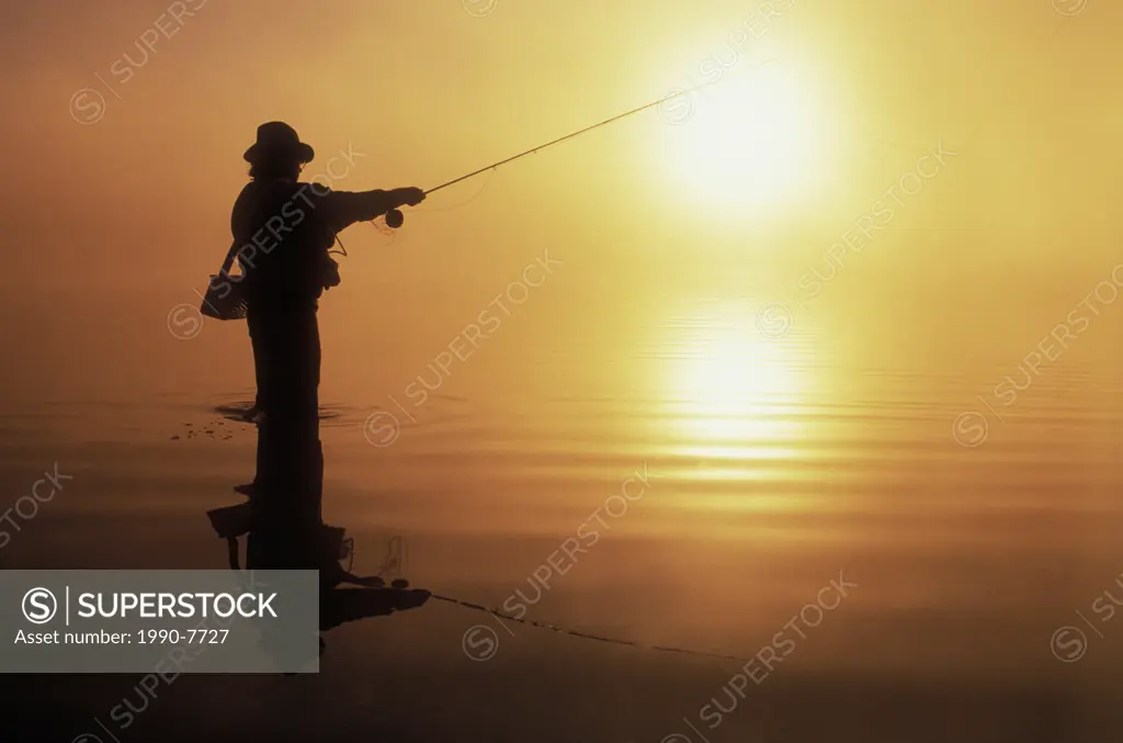 Fisherman at sunset, British Columbia, Canada