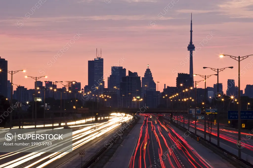 Toronto skyline and QEW highway with morning traffic, Toronto, Ontario, Canada.