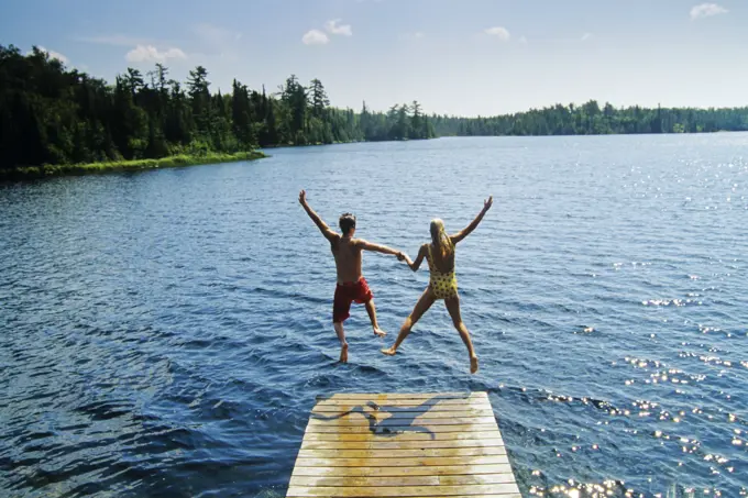 Jumping off dock, Lyons Lake, Whiteshell Provincial Park, Manitoba, Canada.