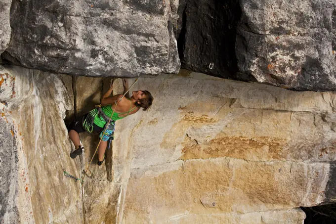 A strong female climber works on Supernatural zombie suspense thriller 11d, Silver City, Castle Mtn, Banff, AB
