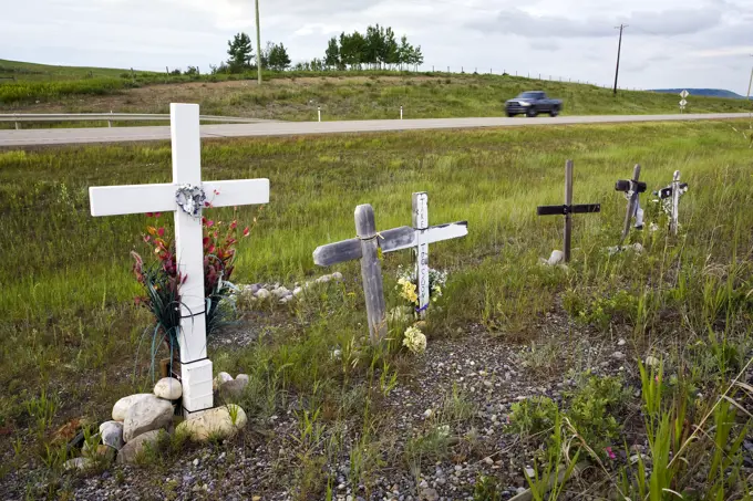 Roadside memorial crosses near Cochrane, Alberta, Canada.