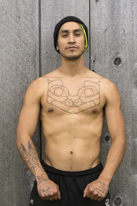 Haida carver with traditional stick and poke tattoo, Haida Gwaii, formerly known as Queen Charlotte Islands, British Columbia, Canada