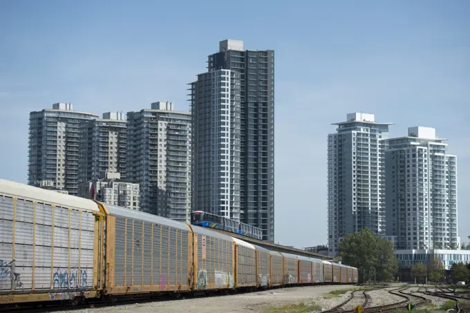 Rail yard, Skytrain and condominiums in New Westminster, British Columbia, Canada.