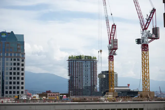 Construction cranes in downtown Vancouver, British Columbia, Canada