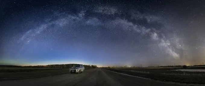 Full milkyway arc over rural road in Manitoba, Canada