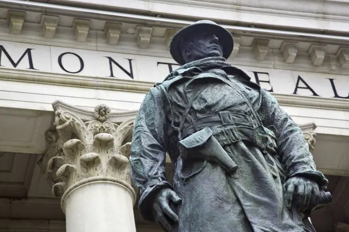 World War One soldier statue and historic Bank of Montreal building fascade. Portage and Main, Winnipeg, Manitoba, Canada.