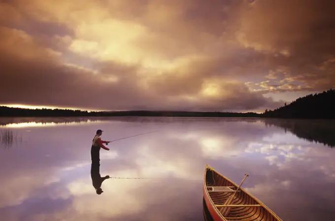 fly fishing on 108 Mile Lake, British Columbia, Canada.