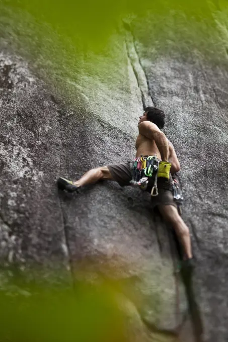 A man rockclimbing S_M´s Delight 10b, Squamish, BC