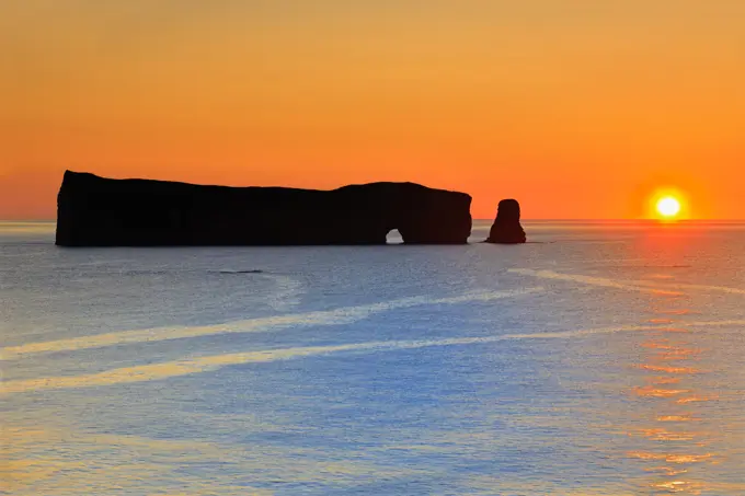 Roche Perce and Atlantic Ocean st sunrise on Gaspe Peninsula, Quebec, Canada