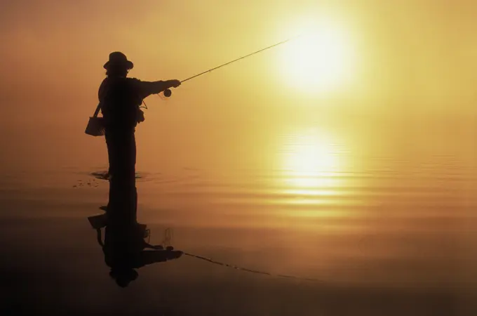 Fisherman at sunset, British Columbia, Canada