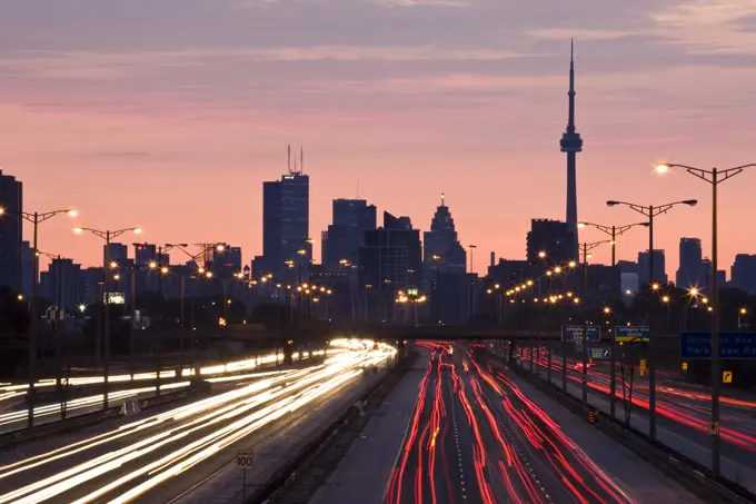 Toronto skyline and QEW highway with morning traffic, Toronto, Ontario, Canada.