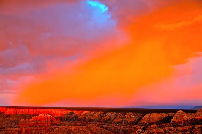 Alpenglow on rain over a canyon, Grand Canyon, Grandview Point, Grand Canyon National Park, Arizona, USA