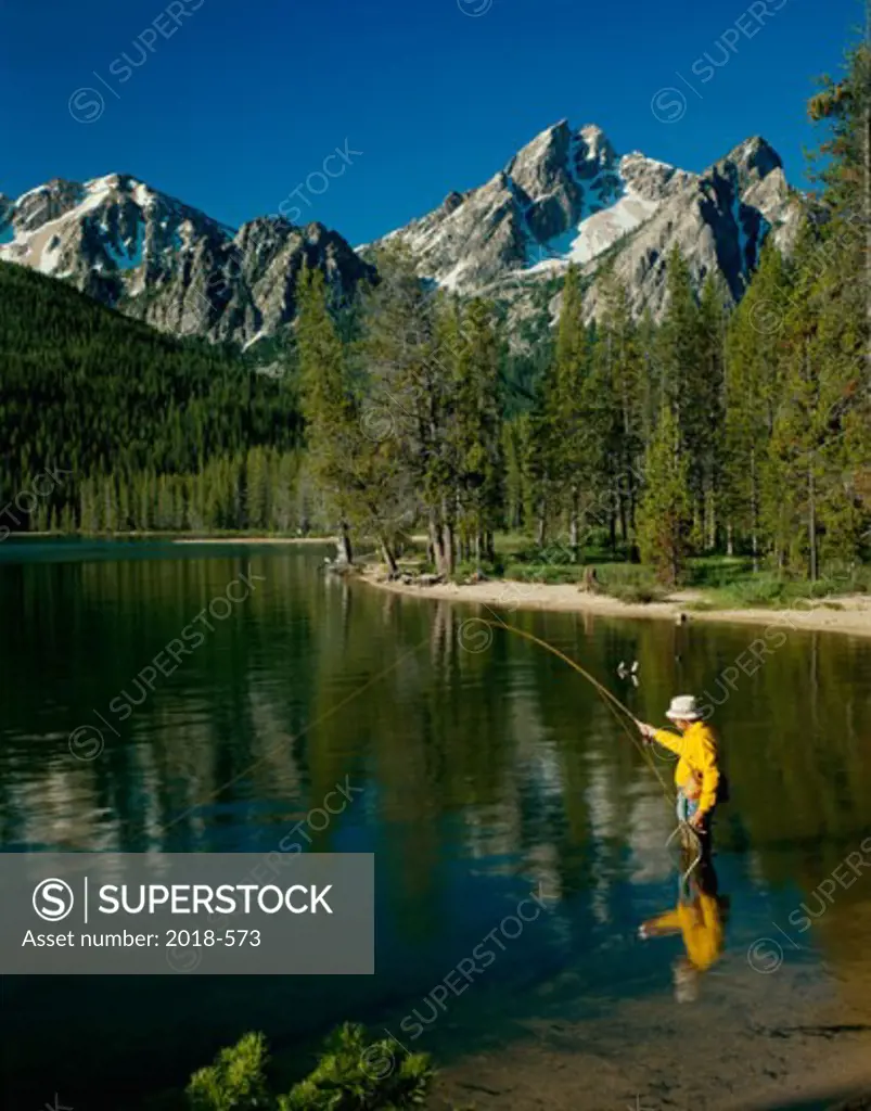 Person fly fishing at Stanley Lake, Sawtooth National Recreation Area, Idaho, USA