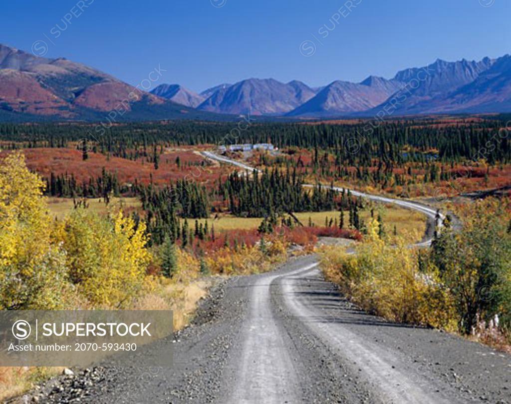 Dirt road passing through a landscape, North Canol Road, Yukon, Canada ...