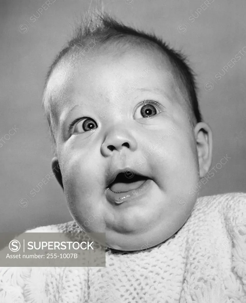 Studio portrait of baby with open mouth