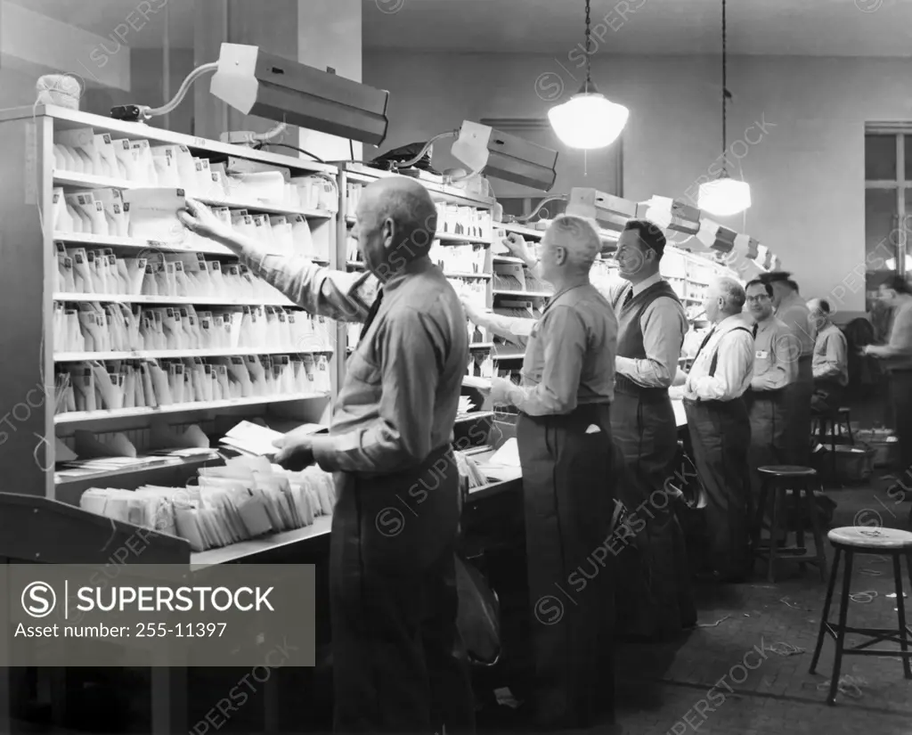 Postal workers sorting mails in a post office, Worchester, Massachusetts, USA