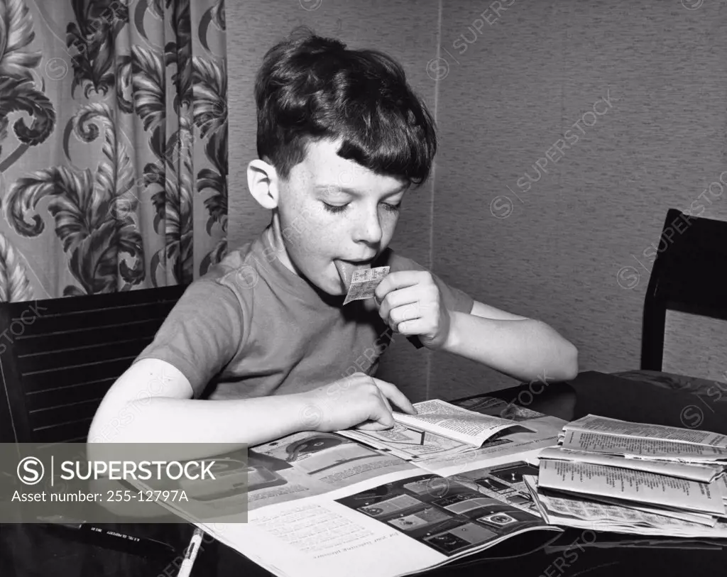 Boy collecting trading stamps