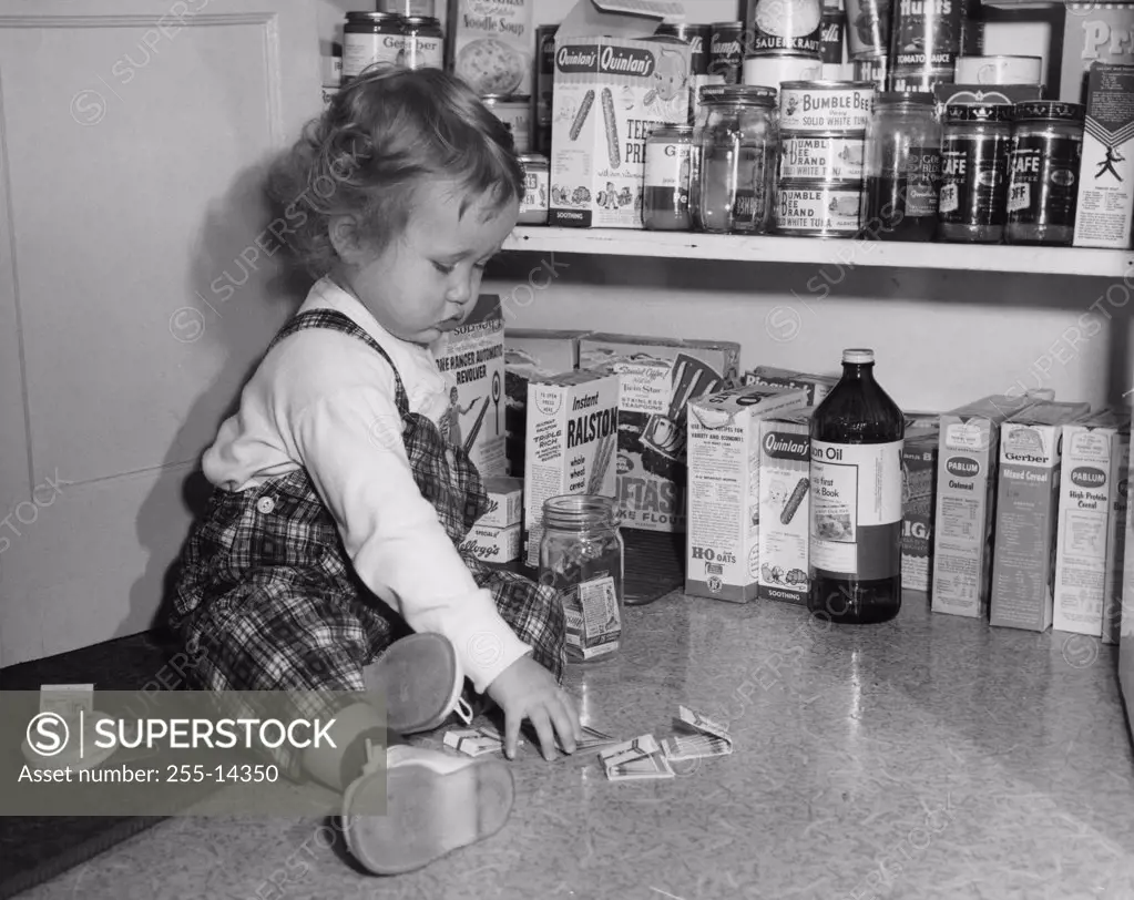 Little girl playing with matches