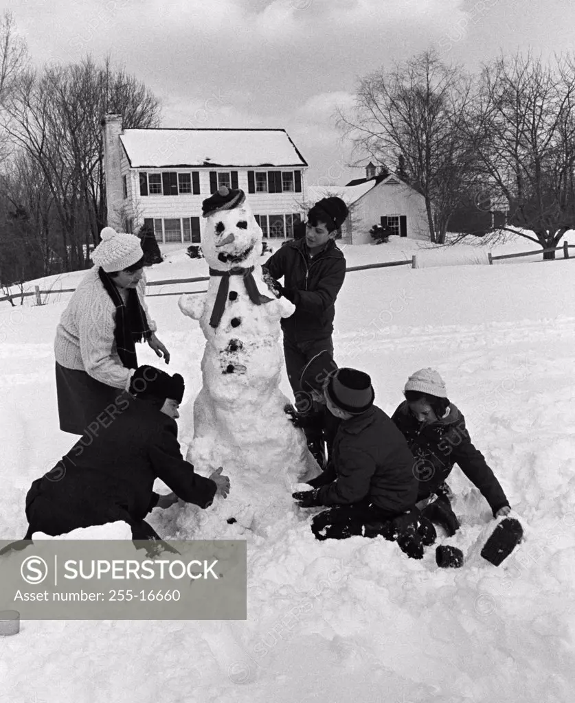 Children making snowman