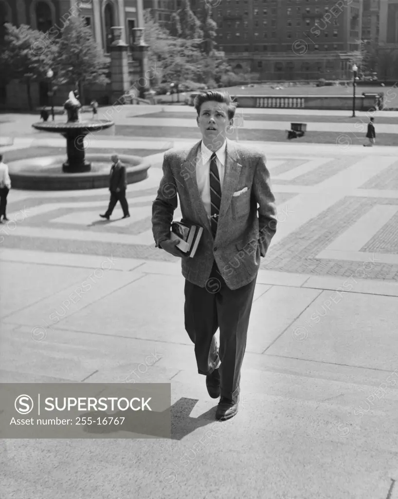 College student walking up steps