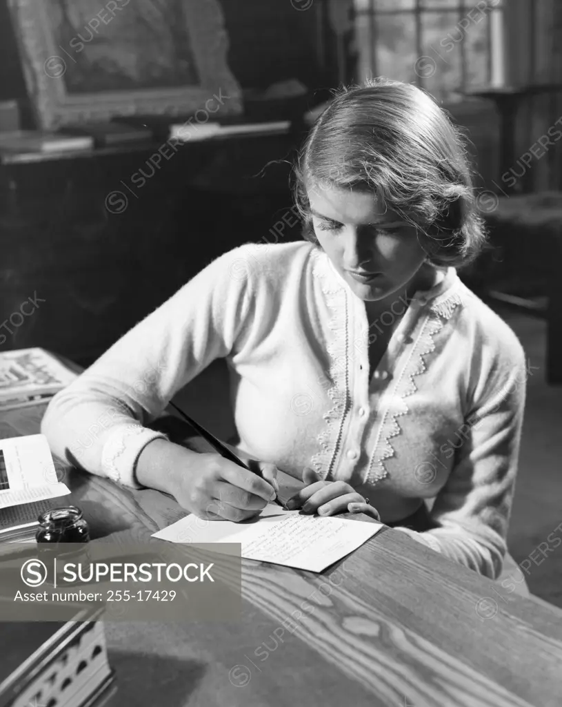 Teenage girl writing a letter