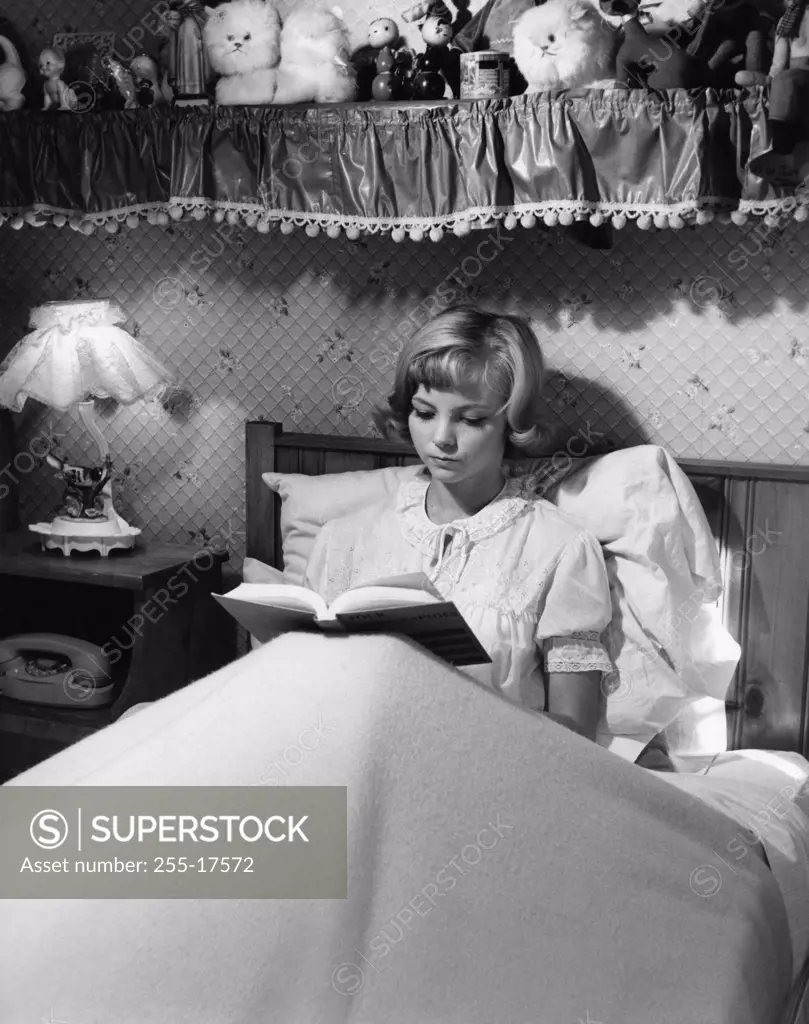 Girl reading in bed