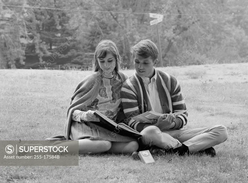 Young couple studying outdoors