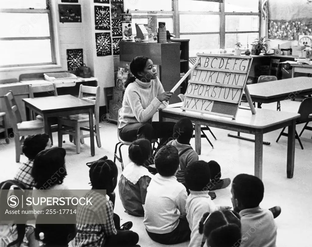 Teacher teaching her students in a classroom