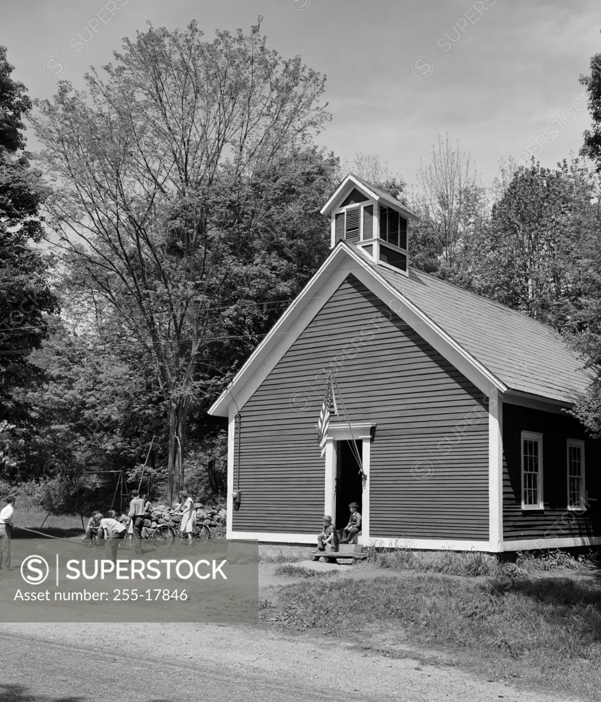 Group of children playing in front of a building, Simonsville, Vermont, USA