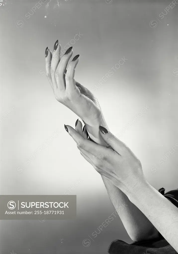 Vintage photograph. Hands with painted fingernails. Model released