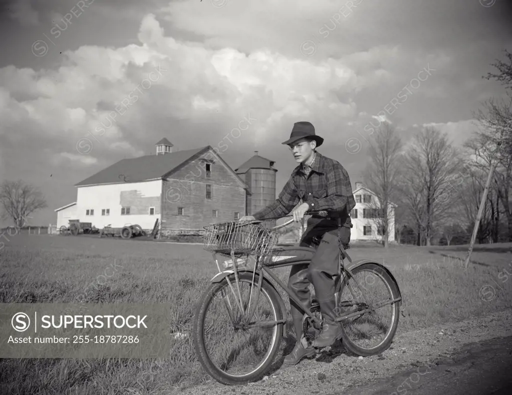 Vintage photograph. Boy on bike in Derry, Massachusetts. New England. Robert Dubeau