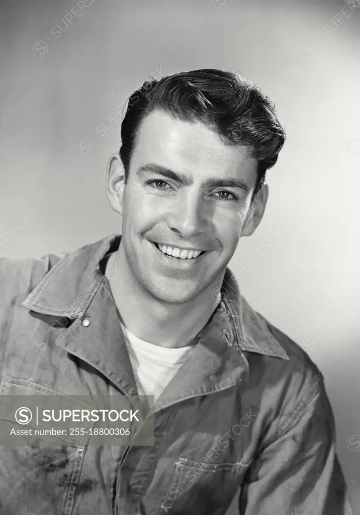 Vintage photograph. Working man smiling looking at camera