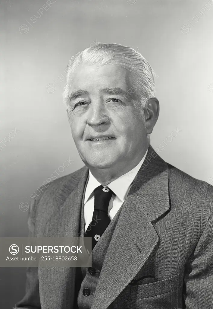 Vintage photograph. Portrait of older businessman smiling