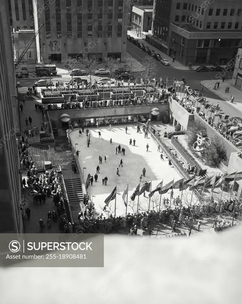 Vintage photograph. View looking down on Rockefeller Center Plaza Ice Skating Rink on Easter Sunday