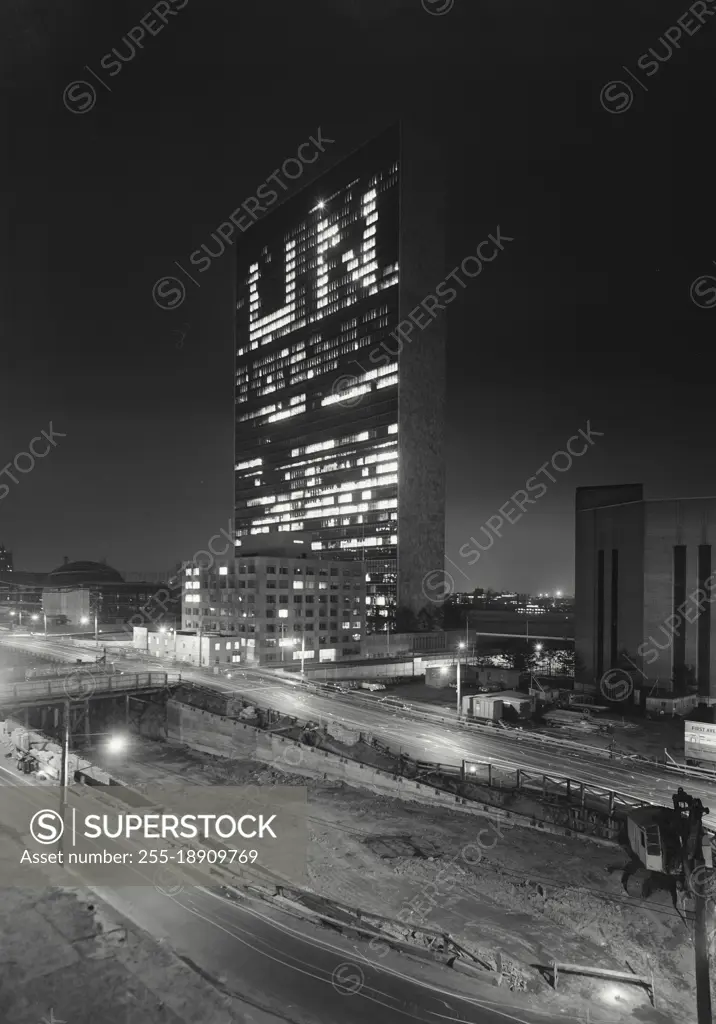 Vintage photograph. united nations building at night with UN in lights