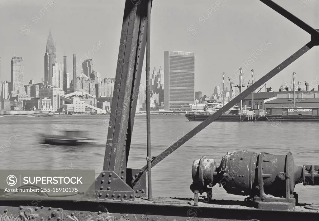 Vintage photograph. View of United Nations Building and Manhattan from structure in East River