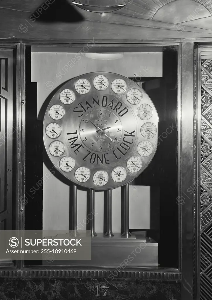 Vintage photograph. Standard time zone clock in the lobby of the N.Y. News Building